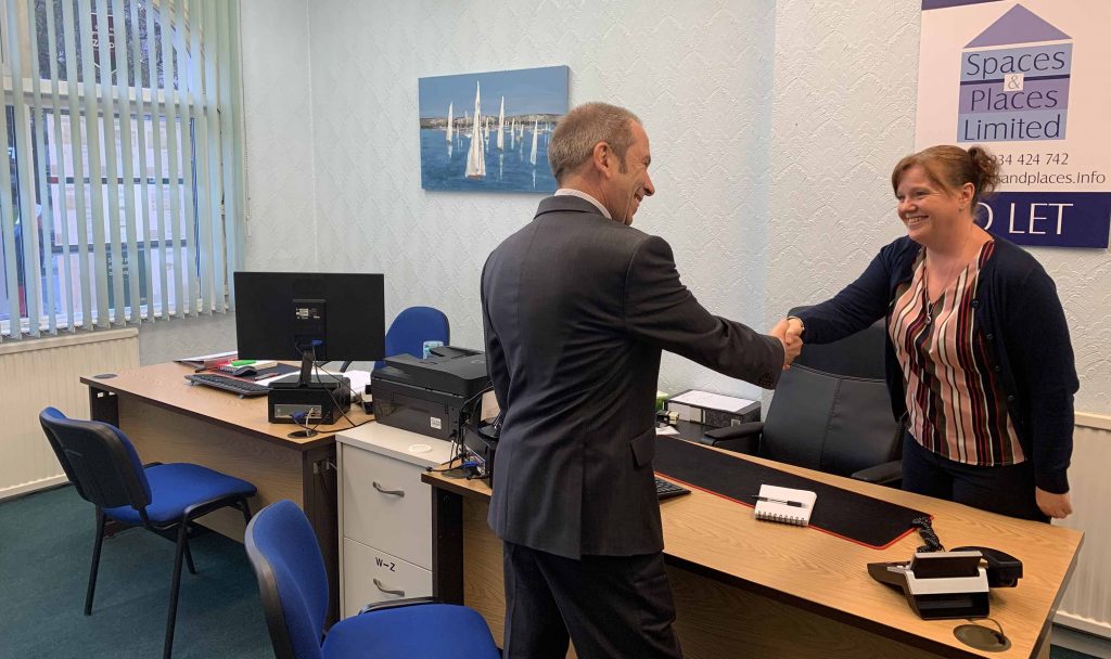 Sam from Spacess and Places shaking a landlords hand